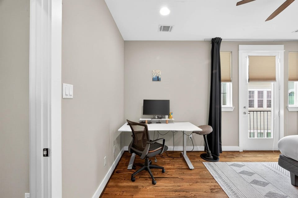 Do you need to finish some work? No problem, we got you covered! This is one of our dedicated workstations, equipped with a monitor, keyboard, and ergonomic chair