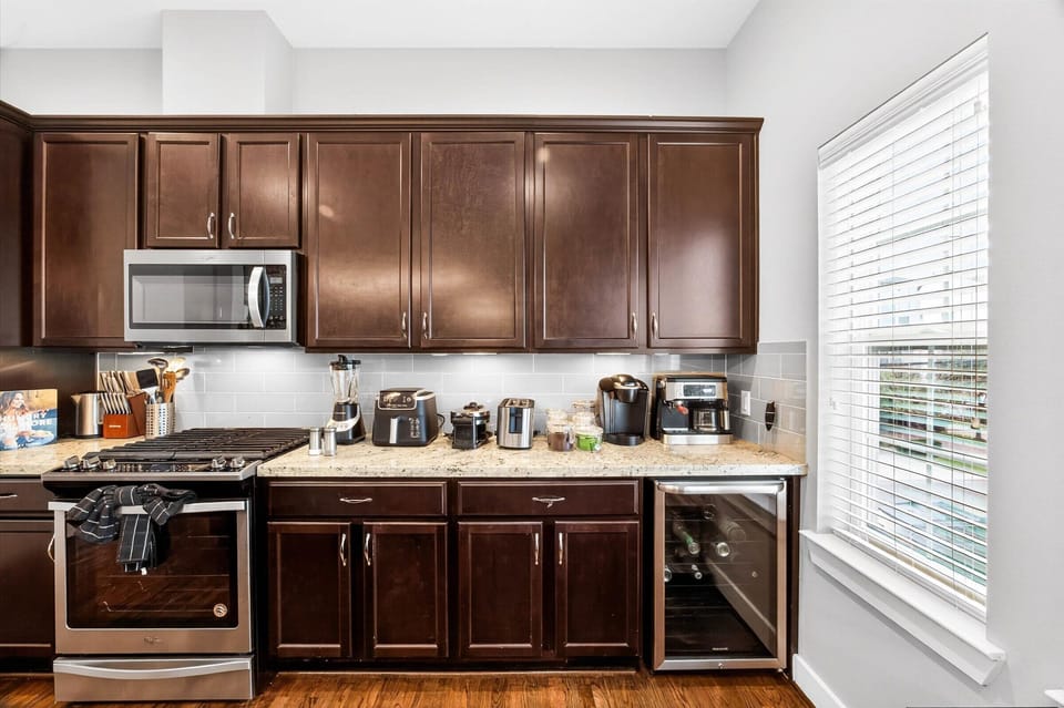 Keurig coffee machine + espresso machine with complimentary coffee, coffee pods, tea, sugar, cream, and sweetener