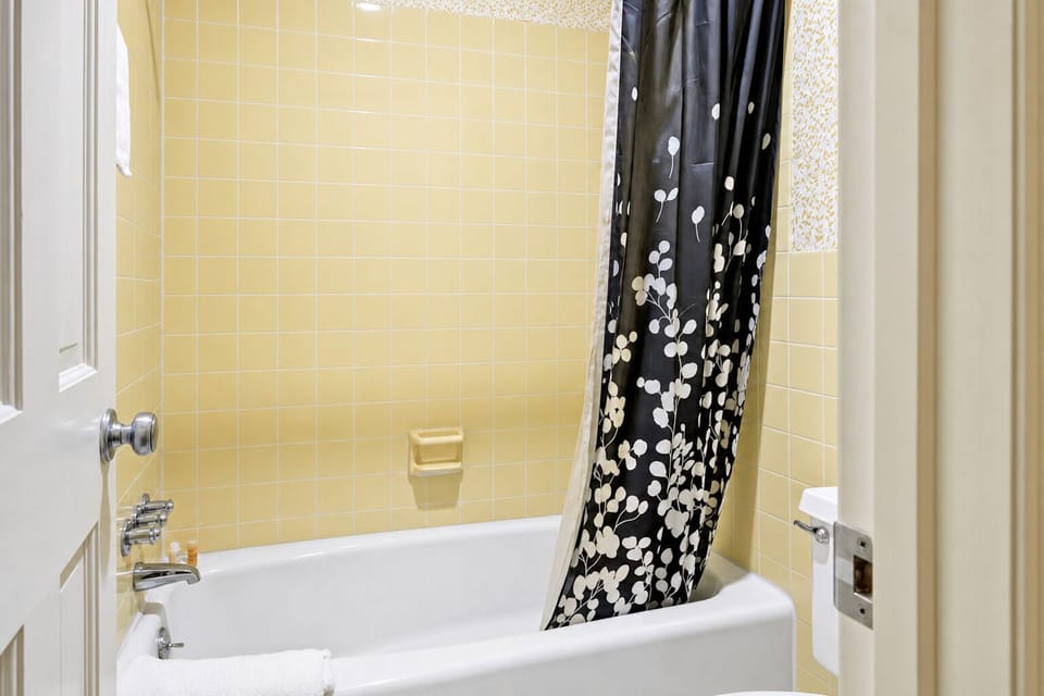 Refresh with a warm shower in a clean, simple bath.