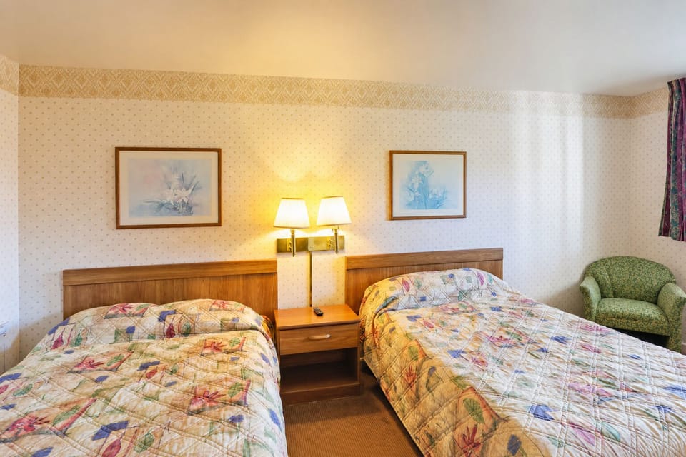 Unwind under warm lamps and sink into cozy quilts.