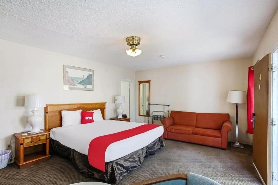 Unwind in a bright king room with cozy sofa seating.