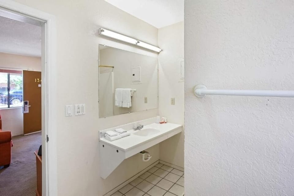Refresh at a spacious vanity with bright, easy lighting.