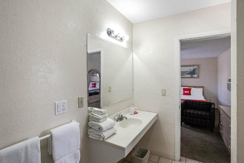 Start mornings with a bright vanity and fresh towels.