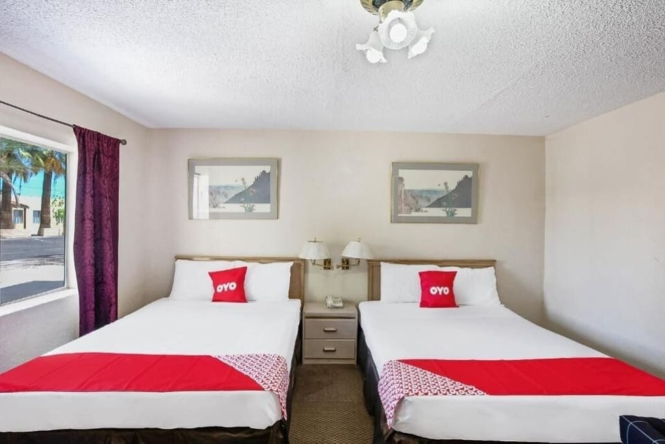 Drift off in crisp linens with bedside lighting convenience.