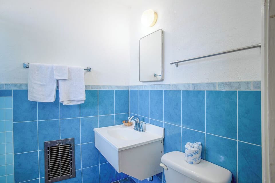 Step into a bright, tidy bath for quick get-ready moments.