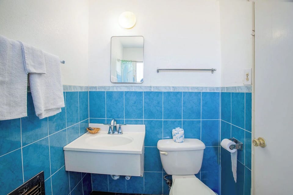 Refresh comfortably with clean towels and an easy vanity setup.