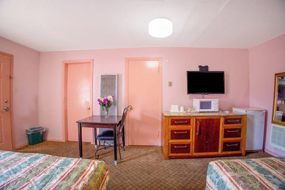Feel at home with dresser storage and a wall-mounted TV.