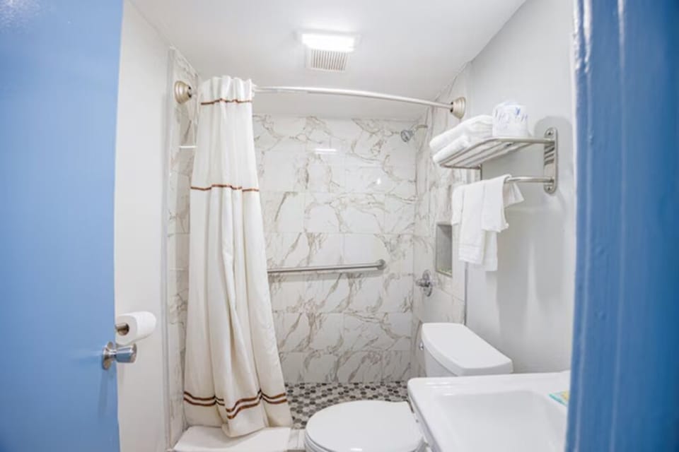 Step into a spotless bath space designed for easy comfort.