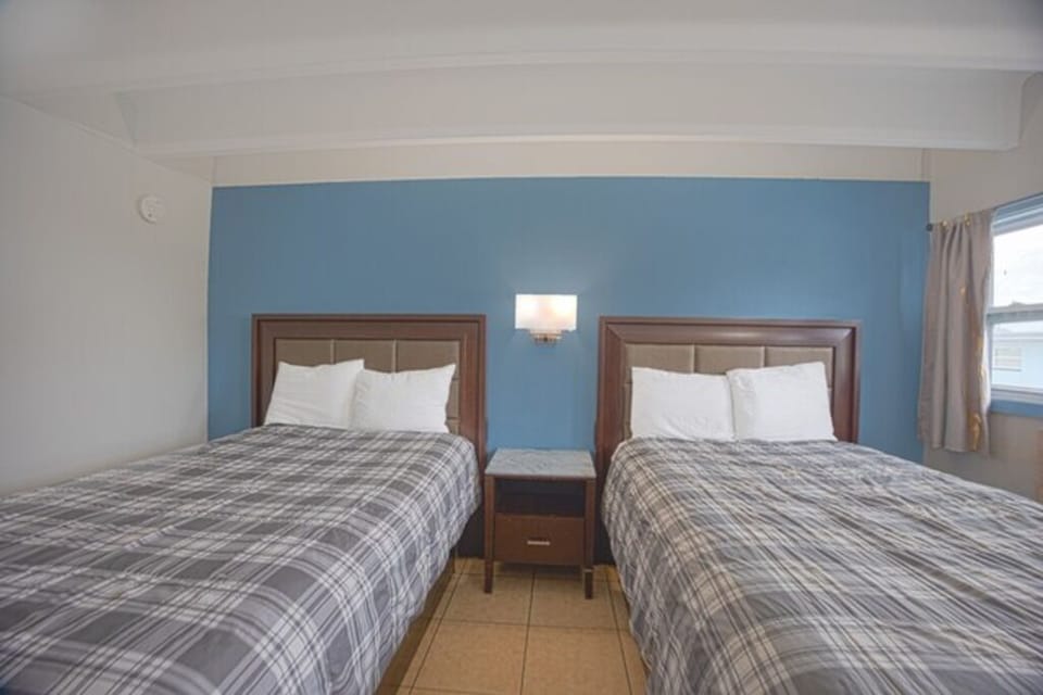 Relax together with matching beds and warm bedside lighting.