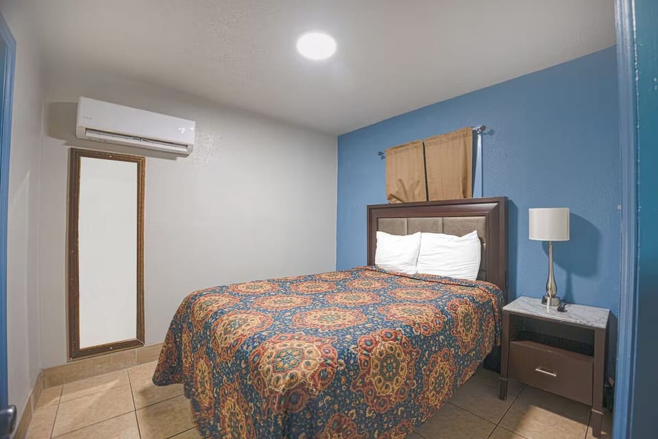 Curl up in a cozy queen bed under soft, cool AC.