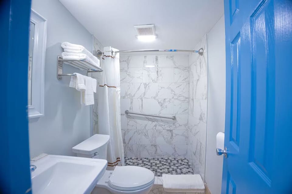 Refresh in a spotless bath with fresh towels ready.
