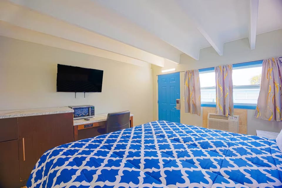 Stretch out and enjoy bright mornings with TV and workspace.