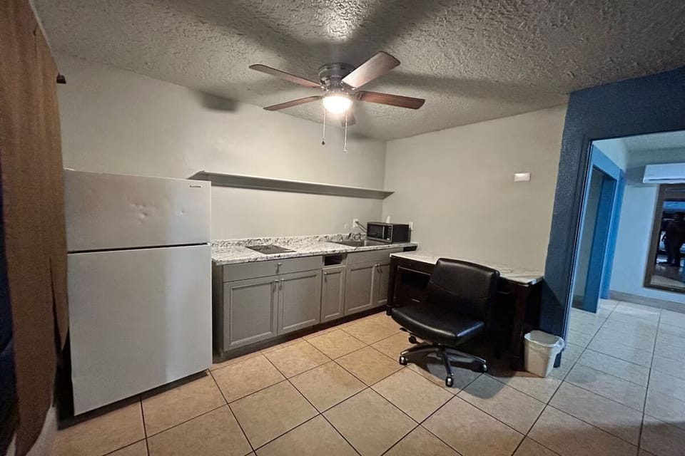 Prep quick meals with practical cabinetry and an easy-clean setup.