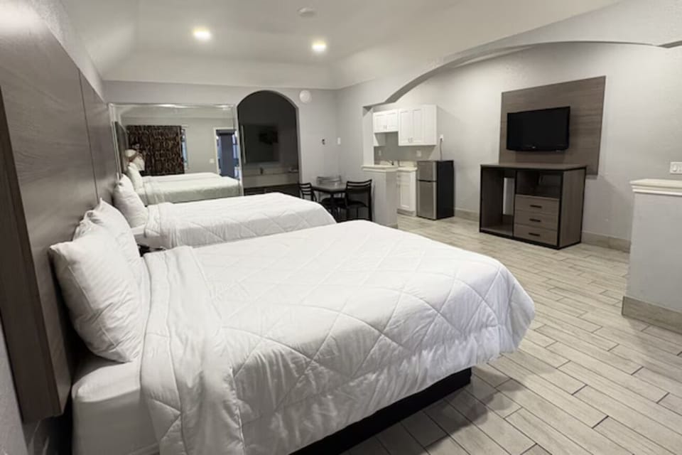 Settle into a spacious suite with comfy beds and TV.