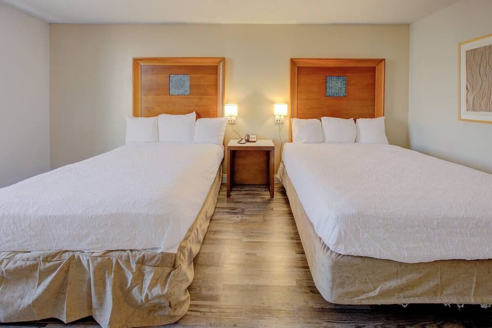 Sink into two plush queen beds for effortless relaxation.
