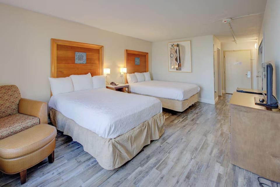 Stretch out on crisp queen beds in a roomy retreat.
