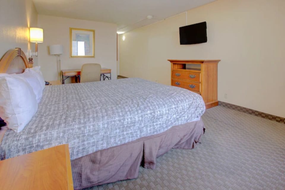 Recharge in a calm king room with plenty of floor space.