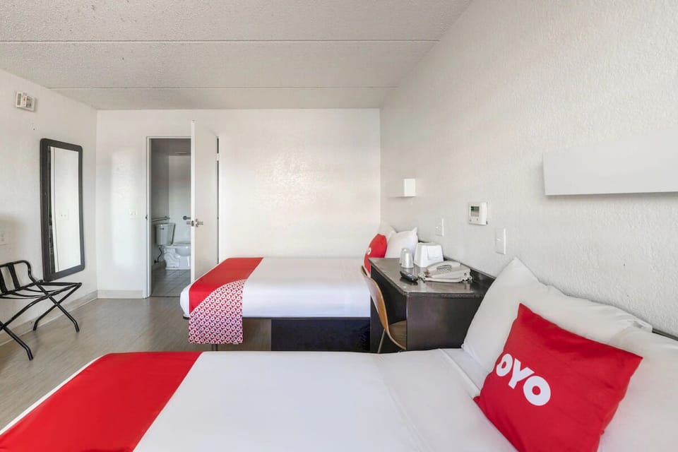 Picture an easy stay with two beds and open floor space.
