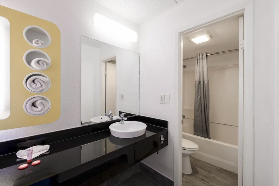 Refresh each morning with a bright vanity and stocked towels.