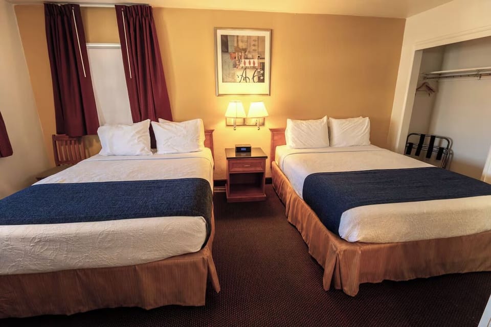 Drift off in crisp linens with space for two to relax.