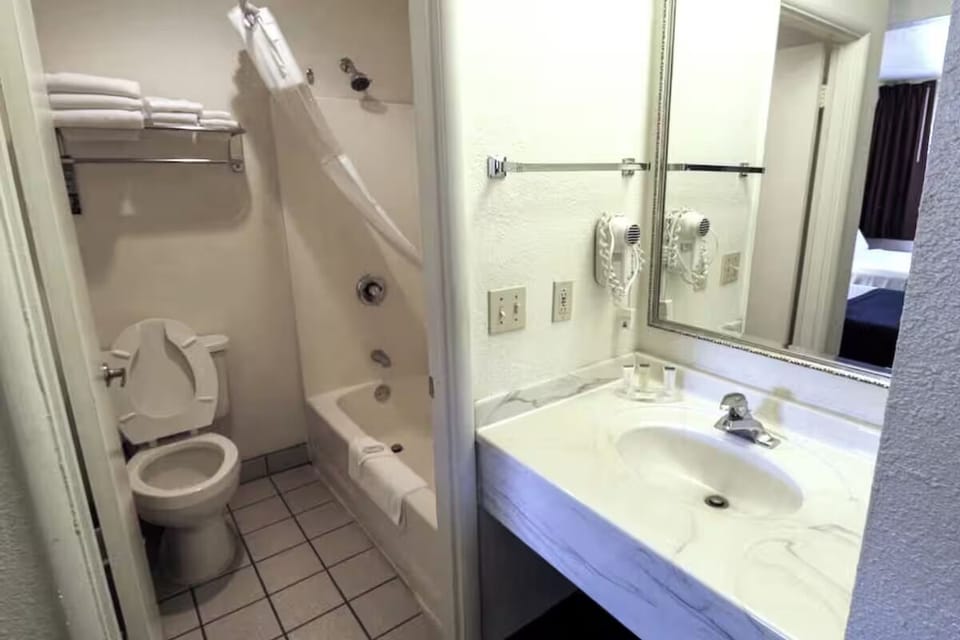 Refresh easily with a bright vanity and convenient shower-tub combo.