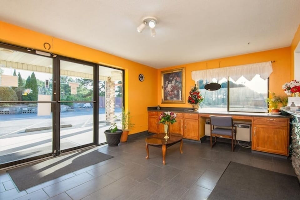 Step into a sunlit lobby with plenty of space.