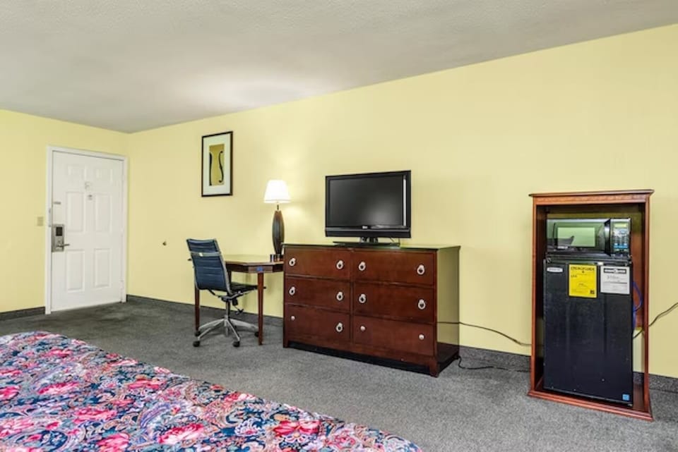 Settle in with a roomy desk, TV, and cold drinks.