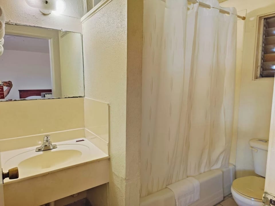 Refresh comfortably with a clean vanity and bright lighting.