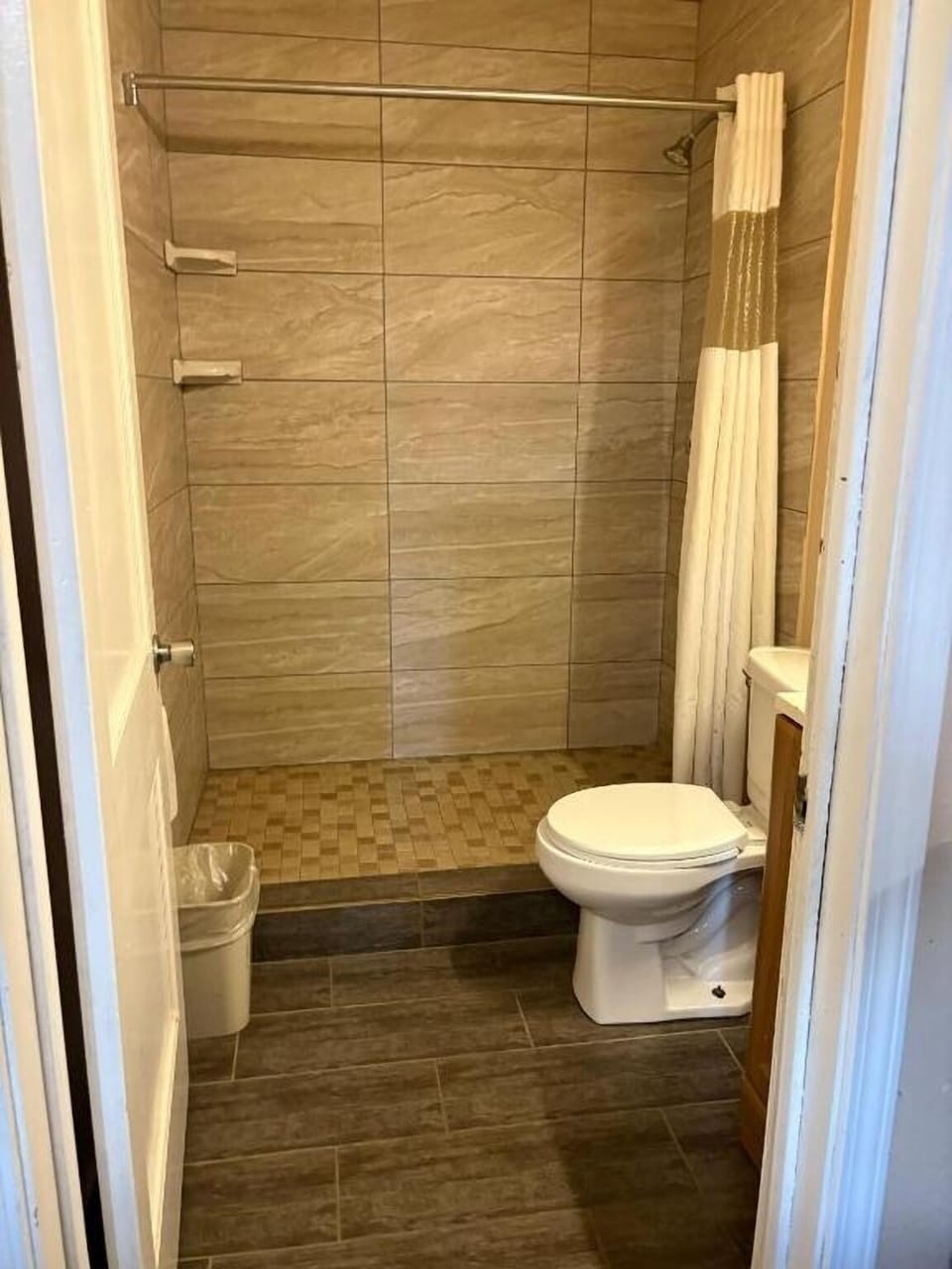 Refresh in a clean, tiled bath with walk-in shower.