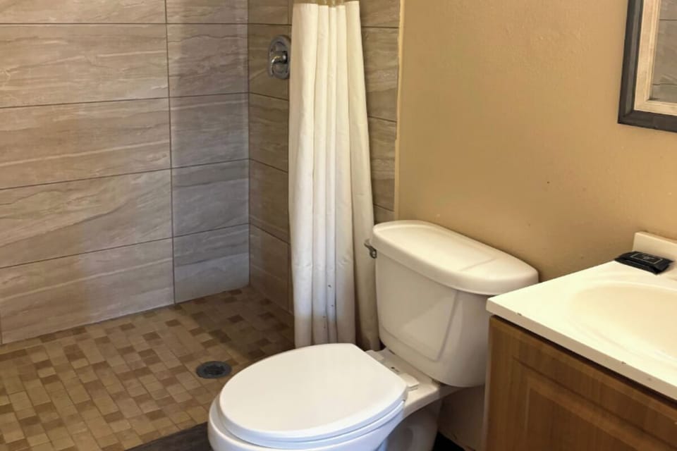 Refresh after a long day in a clean walk-in shower.