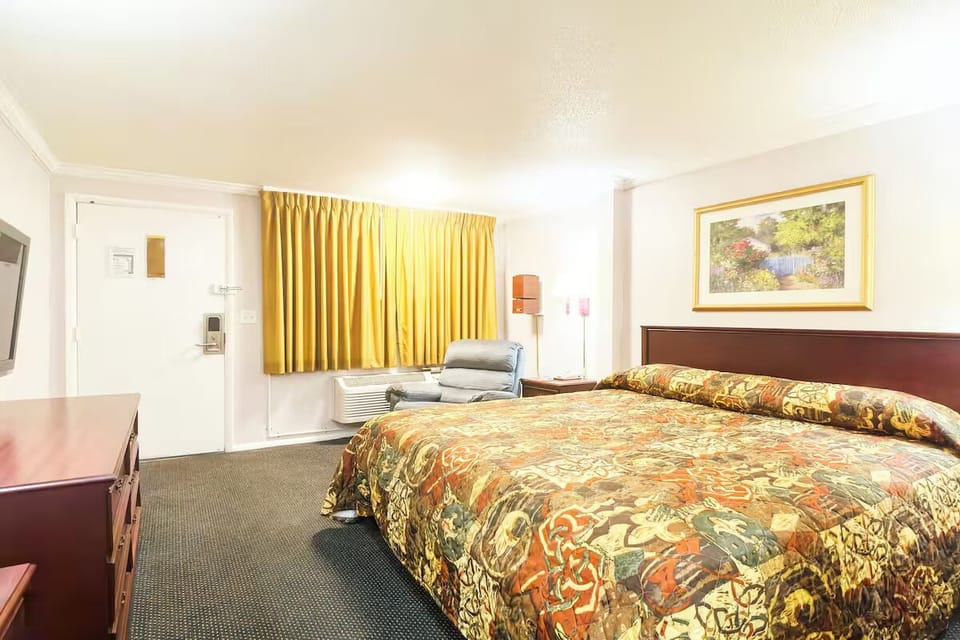 Unwind in a spacious room with cozy lounge chair.