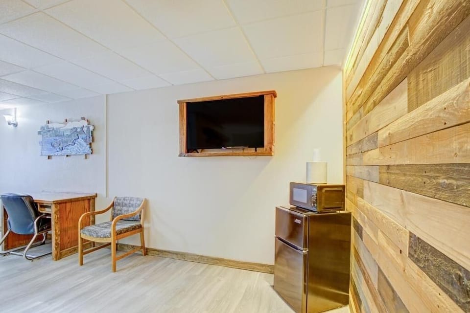 Kick back with wall-mounted TV and easy in-room snacks.