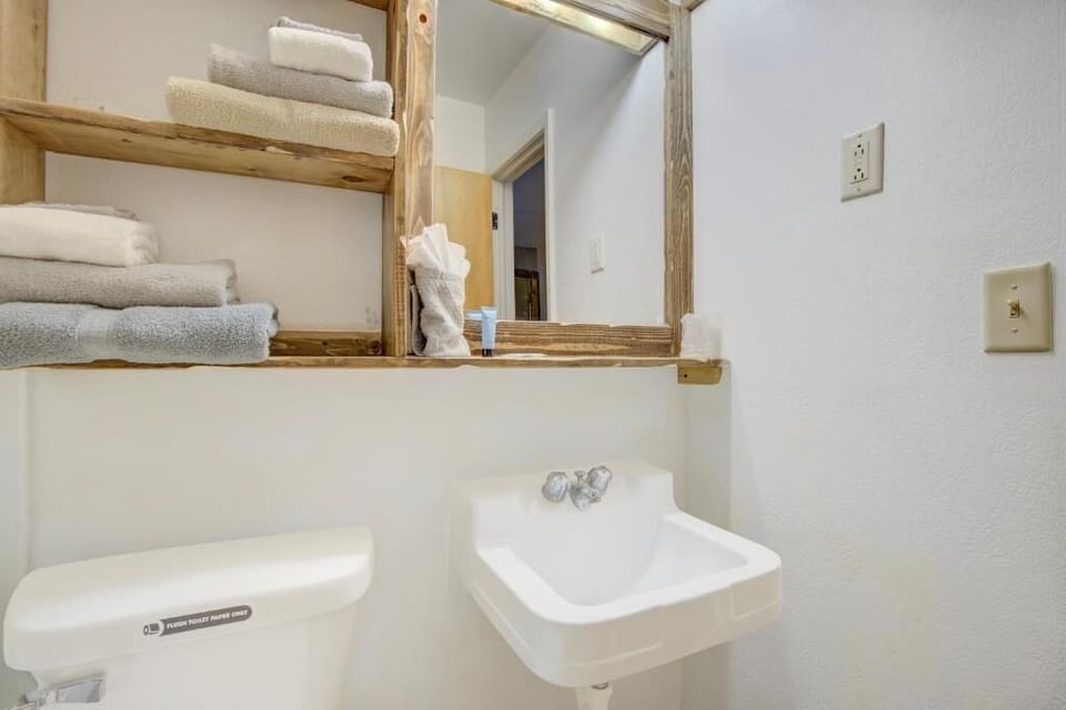 Freshen up fast at the compact sink with simple, clean finishes.