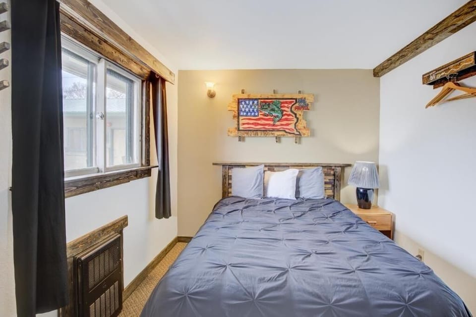 Unwind into crisp linens beneath warm rustic beams.