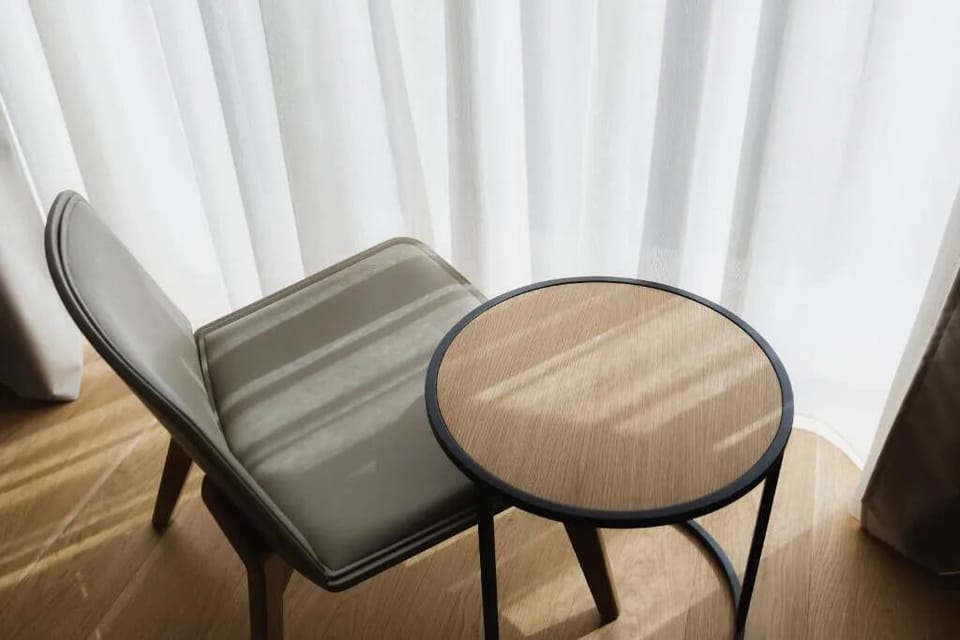 Bask in filtered daylight at a cozy side table.
