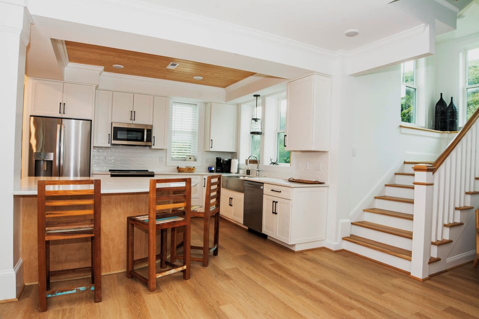 First floor full gourmet chef’s kitchen and open dining and living spaces