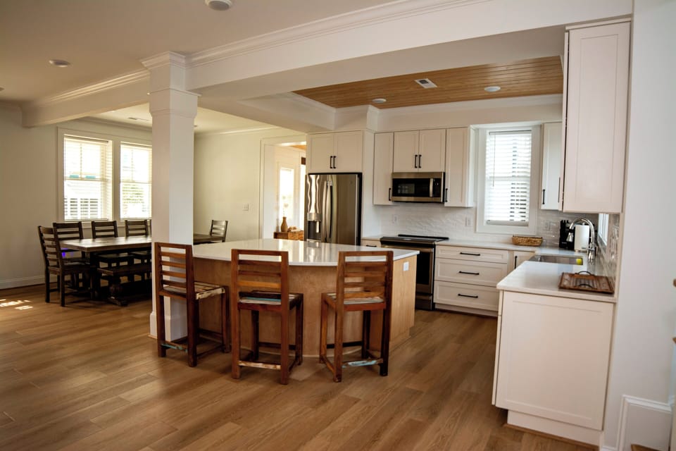 First floor full gourmet chef’s kitchen and open dining and living spaces