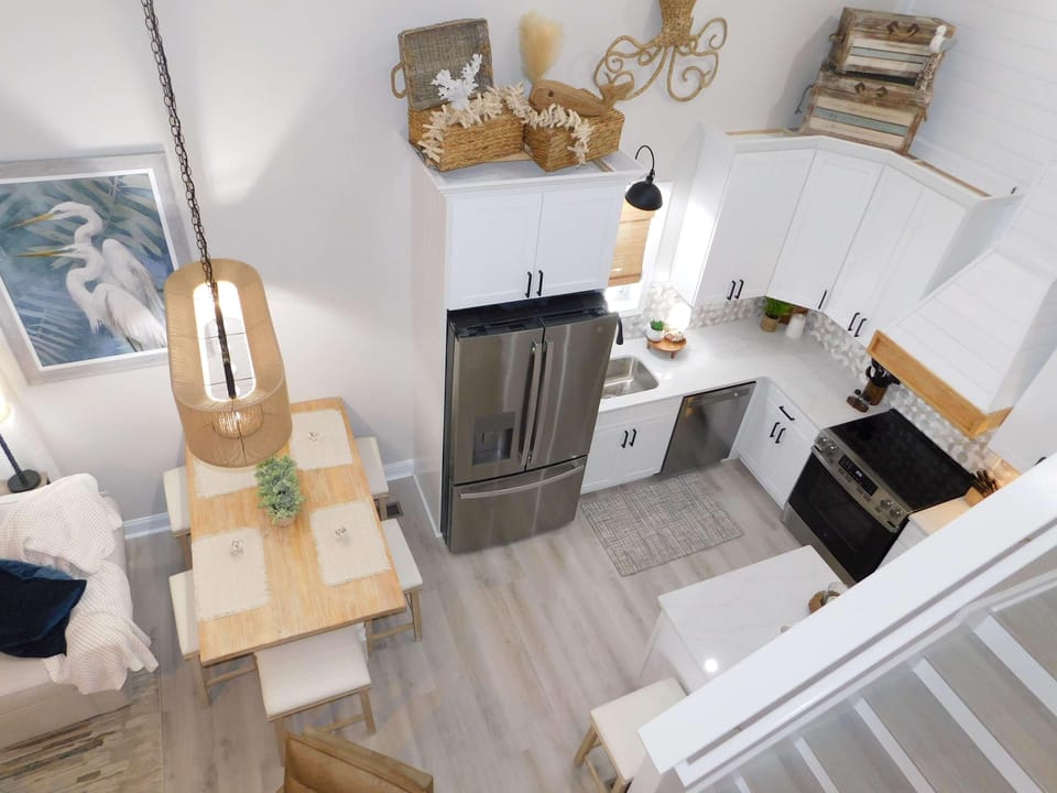 Bright, modern kitchen with cozy dining nook for gatherings