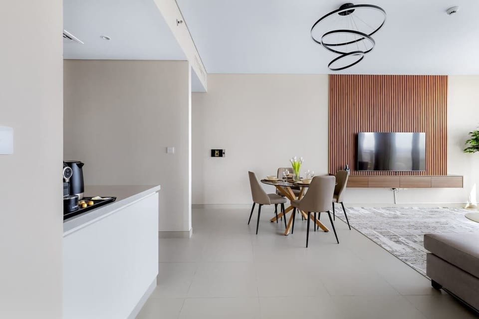 Contemporary dining space seamlessly integrated into the living area, offering a sophisticated setup perfect for family meals or entertaining guests.