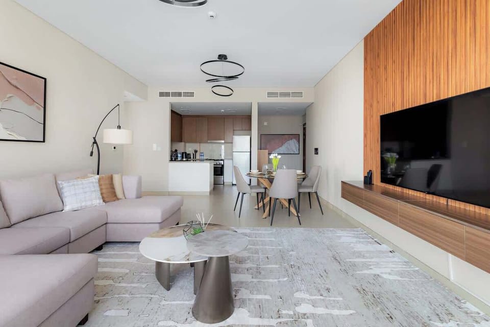Elegant and functional living area with modern decor and an artistic touch. Perfect for unwinding after exploring Dubai Marina and JBR nearby.