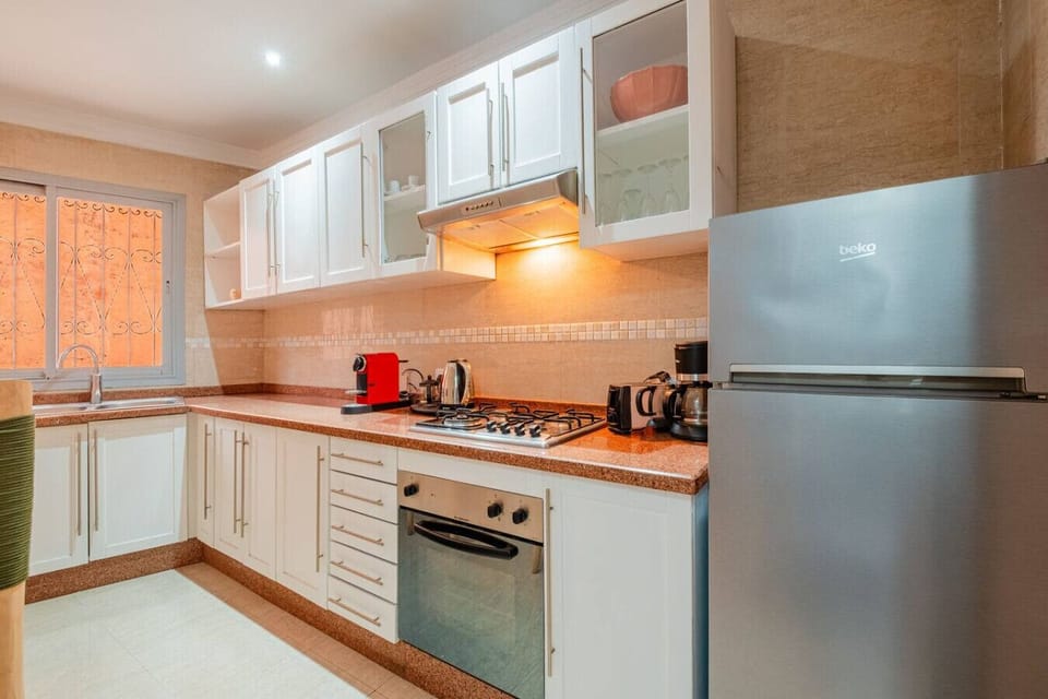 Fully equipped kitchen with modern appliances.