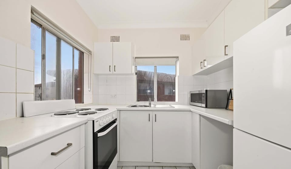 Well-maintained kitchen with practical layout and generous cupboard space.