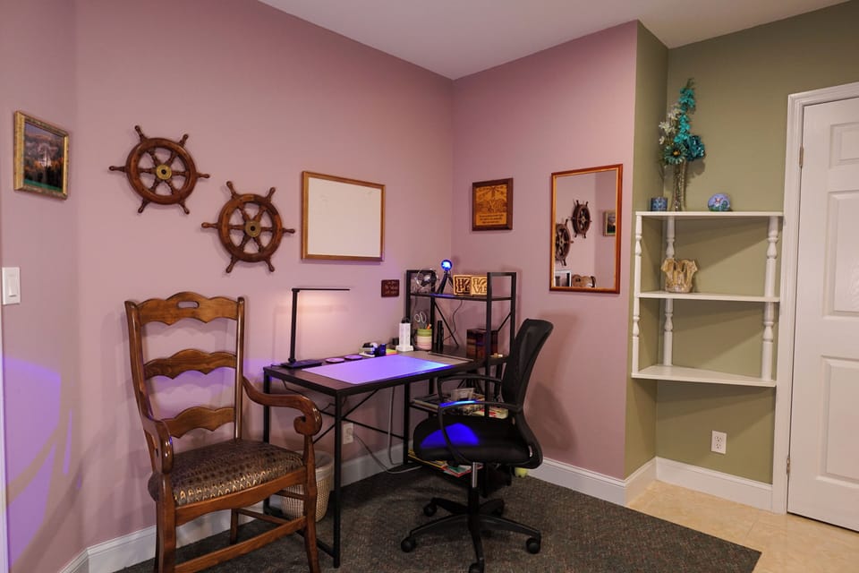 Desk Area in master bedroom. Includes many office supplies.