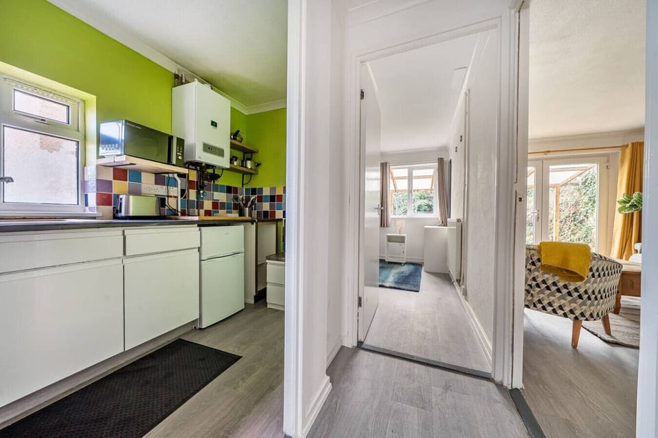 Enter through the hallway with easy access to the kitchen and living area