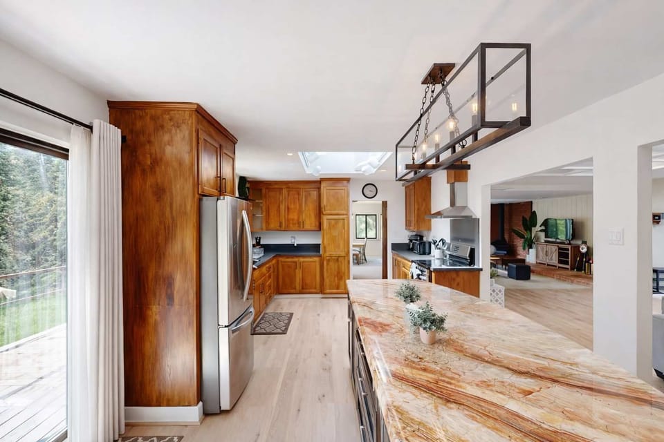 Beautiful dining area with soft tones, large windows, and plenty of space to enjoy meals together.