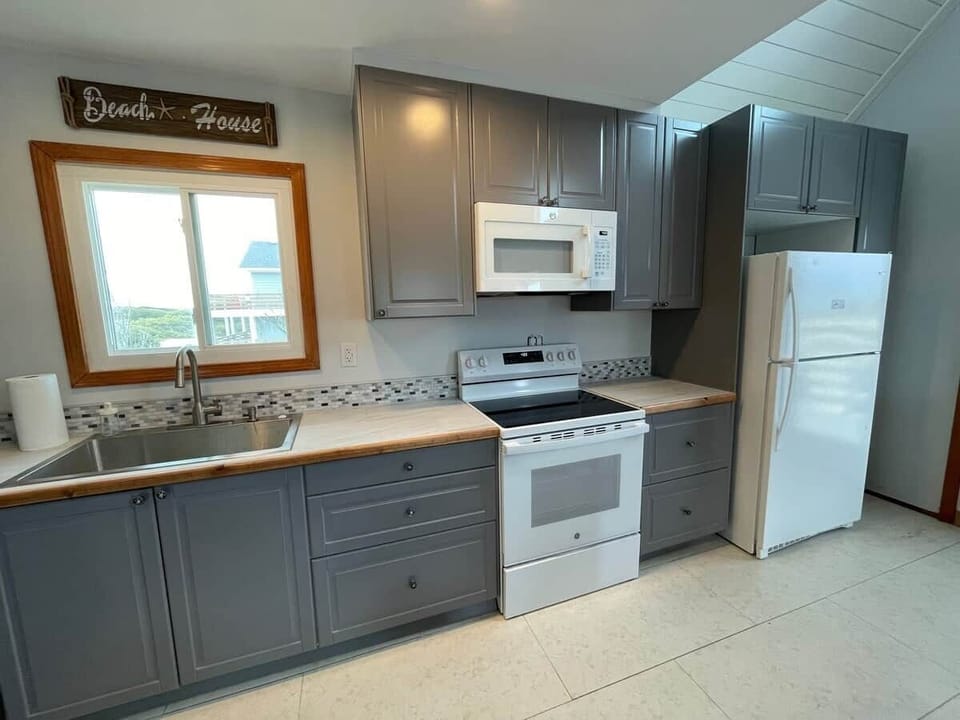 Kitchen is well-equipped for cooks and includes basic spices