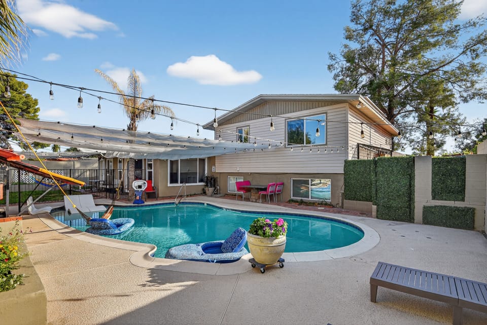Inviting backyard pool designed for relaxation & play, making it a highlight.