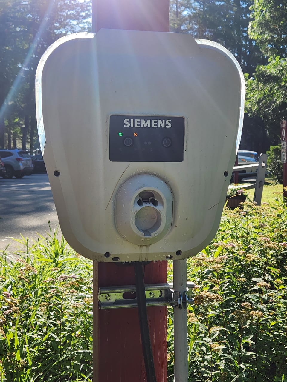 EV charger located on parking spot closest to the unit.