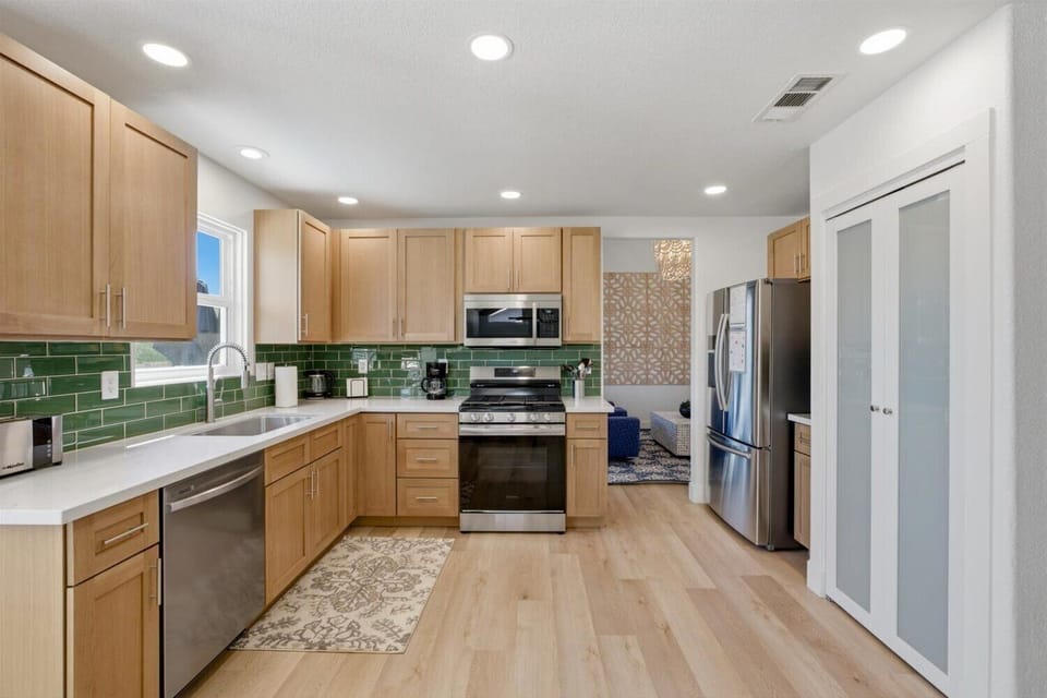 Just-remodeled, well-stocked kitchen. Ground coffee is provided for drip coffee maker. There is also an electric kettle, blender, waffle maker, and lots of pots, baking pans, etc