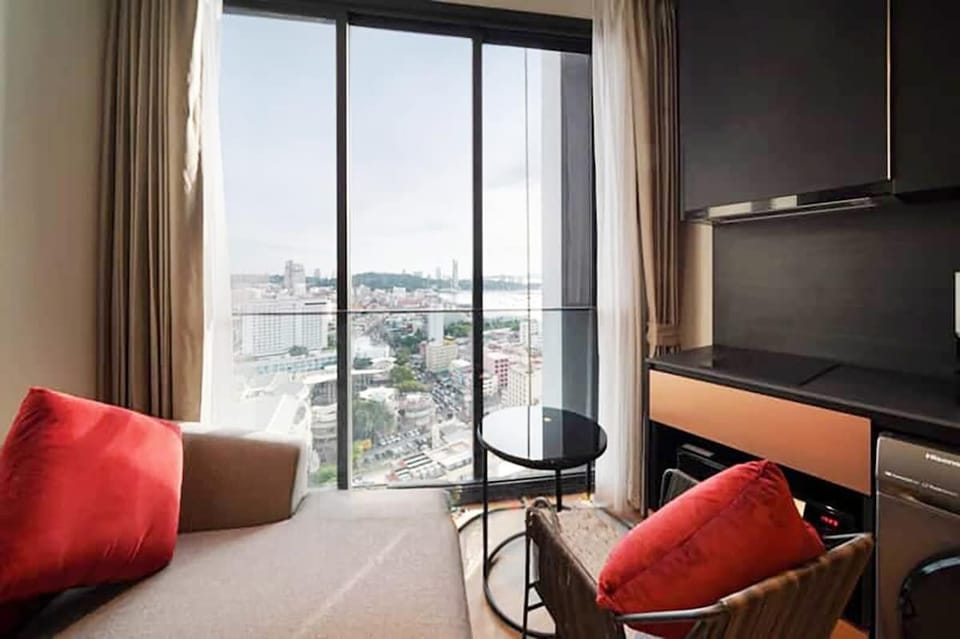 This is the sitting area of the room. The window has been tinted to enjoy the Seaview from the room. 